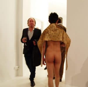 Man in Suit Meets Cloaked Nude