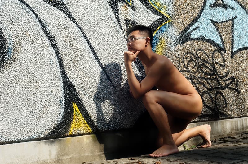 Silent Pondering by Graffiti Wall